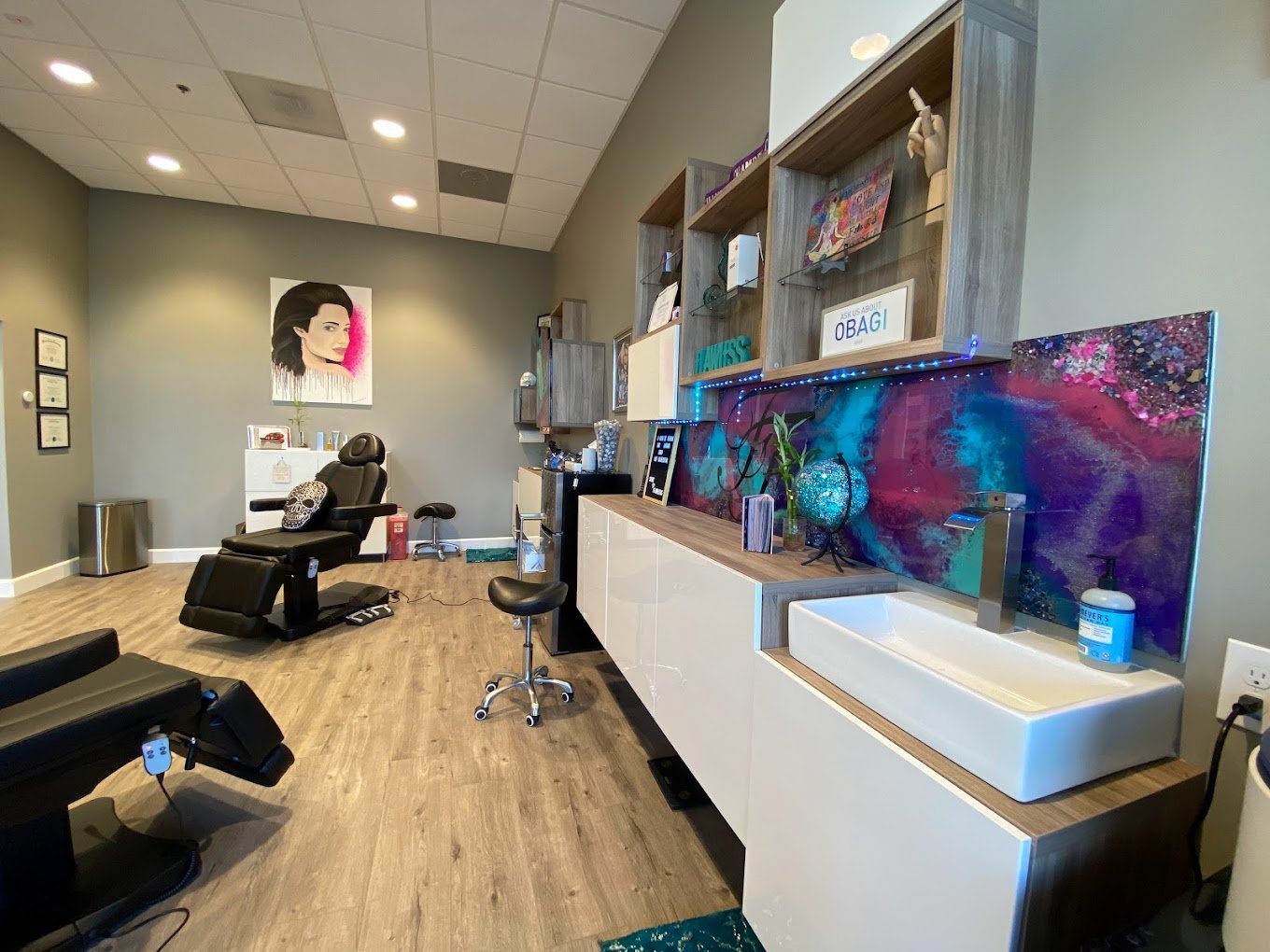 Inside Flawless Faces MedSpa Chandler — treatment room with butterfly resin art